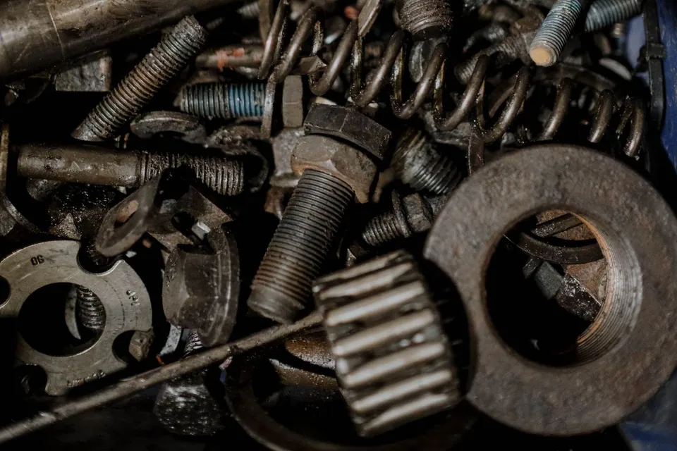 Assorted metal gears and spare components
