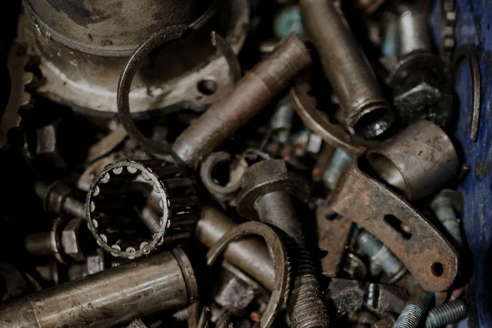 Assorted metal gears and spare components