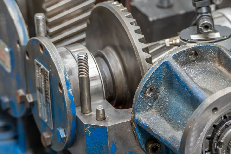 Close-up of metal gears and machine components