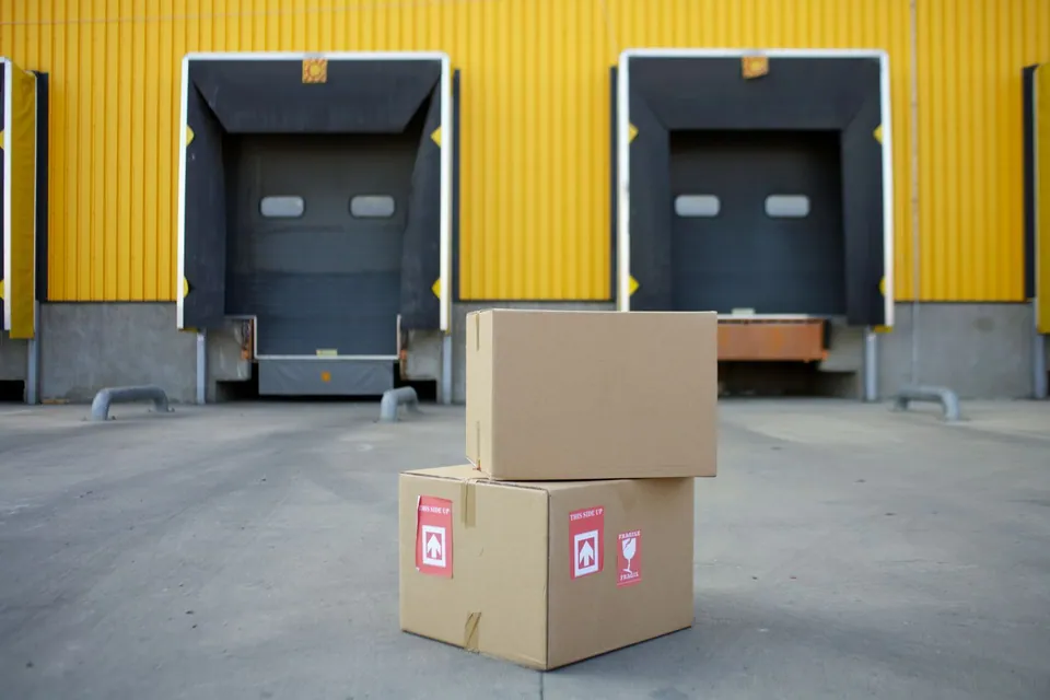 Cardboard boxes near warehouse loading doors